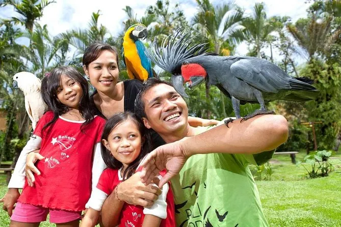 Bali Family Adventure: Parents and children at the Bali Zoo during an exciting wildlife encounter.